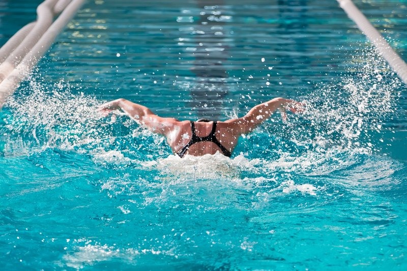 2203556-swimmer-athlete-with-splashes-of-swims-in-the-pool.jpg